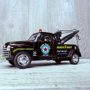 1953 Chevrolet 3100 Wrecker model toy truck with tow hook and string collectable